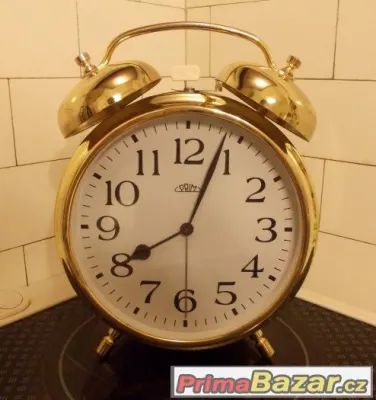 Velký zlatý mechanický budík zn. PRIM