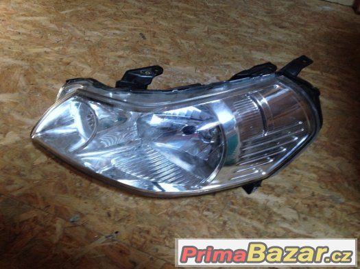 levý přední reflektor - SUZUKI SX4 levý přední reflektor - SUZUKI SX4