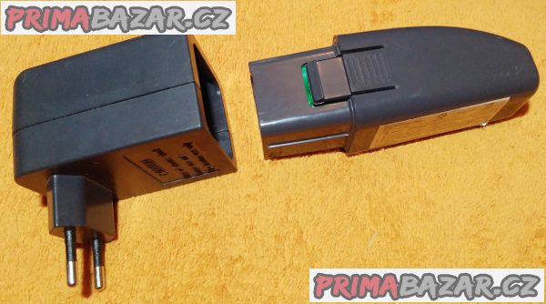 Nabíječka baterie s baterií ke kartáči Swivel Sweeper. Nabíječka baterie s baterií ke kartáči Swivel Sweeper.