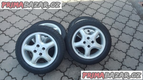 Originální alu kola Opel Tigra + letní pneu (4mm) Originální alu kola Opel Tigra + letní pneu (4mm)
